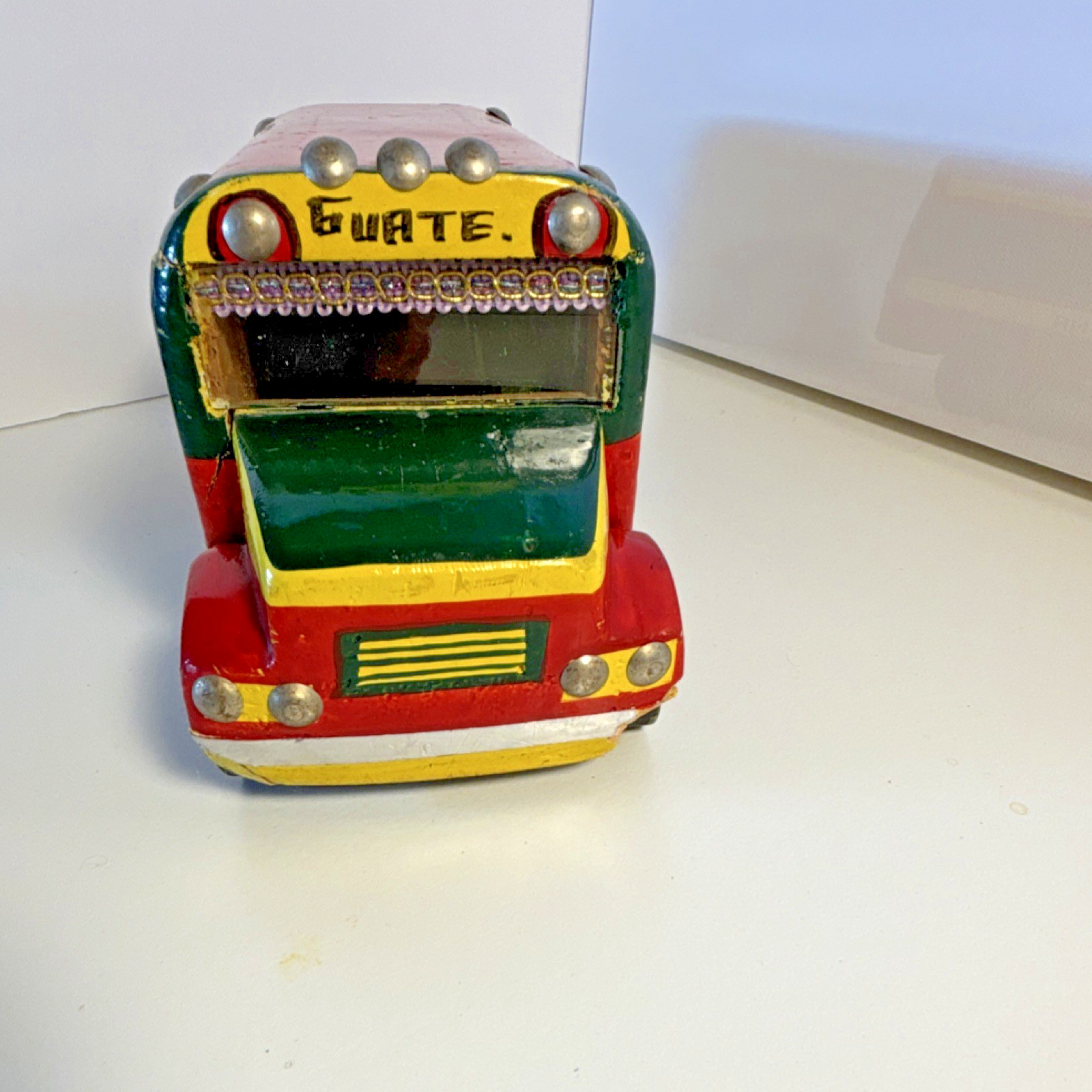 Vintage hand-painted, collectible toy replica of a Guatemalan “chicken bus”.