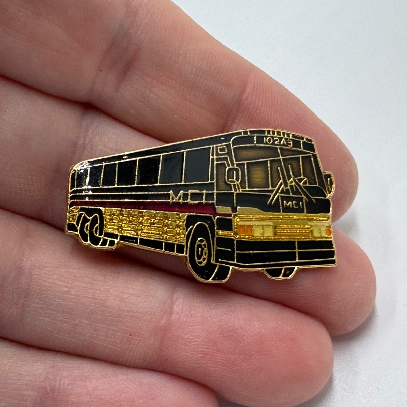Vintage MCI 102A3 Coach Bus Lapel Pin Black Gold Enamel