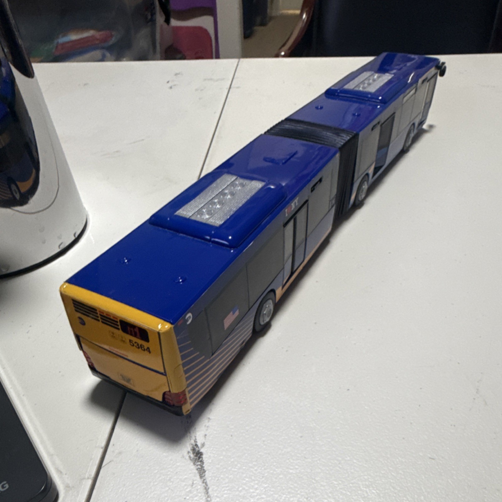 MTA Articulated Bus Model M1 via 5th Ave Blue/Yellow 5364 210611 Collectible