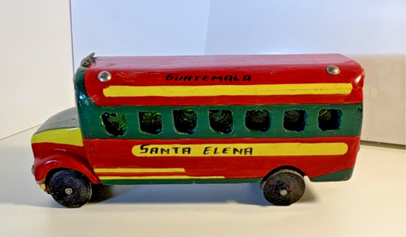 Vintage hand-painted, collectible toy replica of a Guatemalan “chicken bus”.