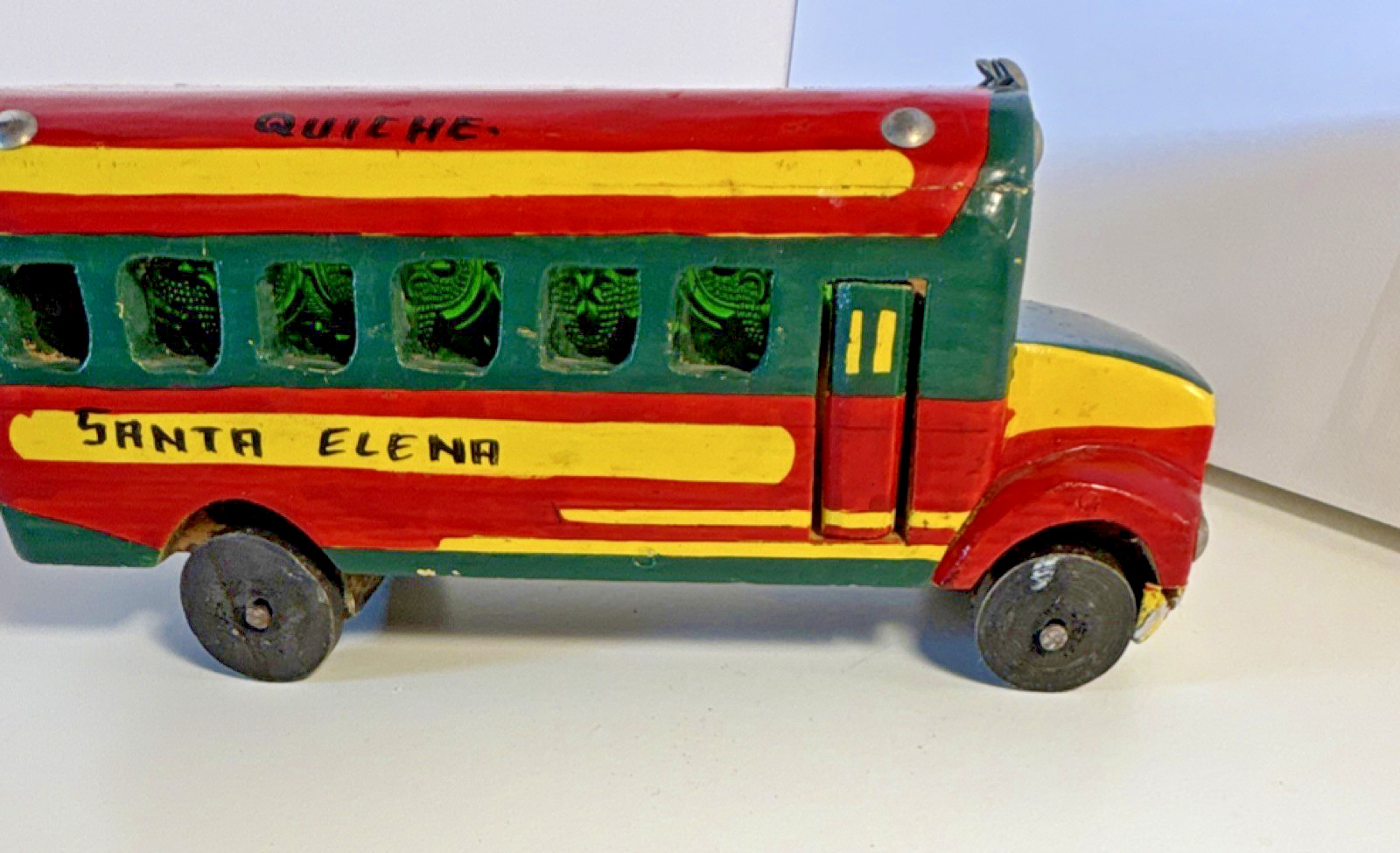 Vintage hand-painted, collectible toy replica of a Guatemalan “chicken bus”.