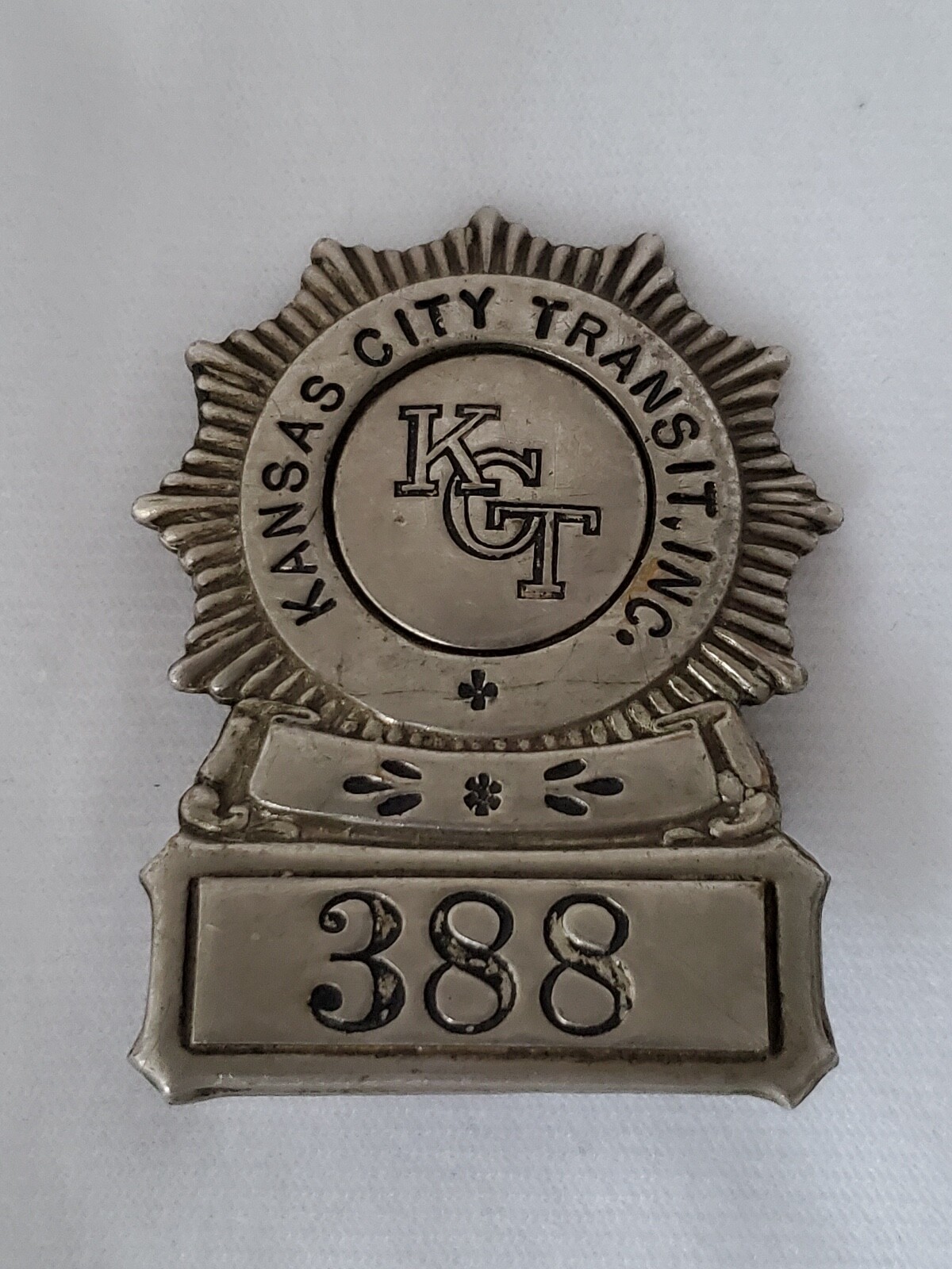 VINTAGE KCT KANSAS CITY TRANSIT INC. #388 OPERATOR CAP BADGE