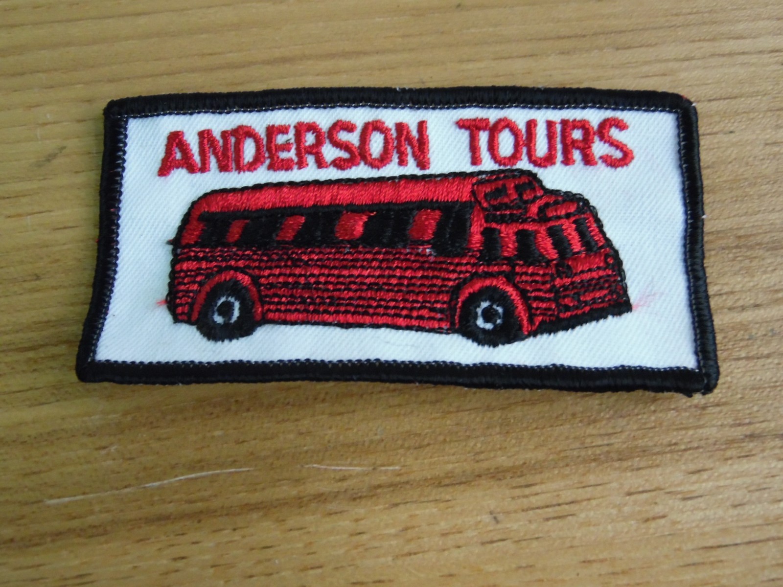 anderson tours bus tours jacket shirts sew on patch red and white 4×2
