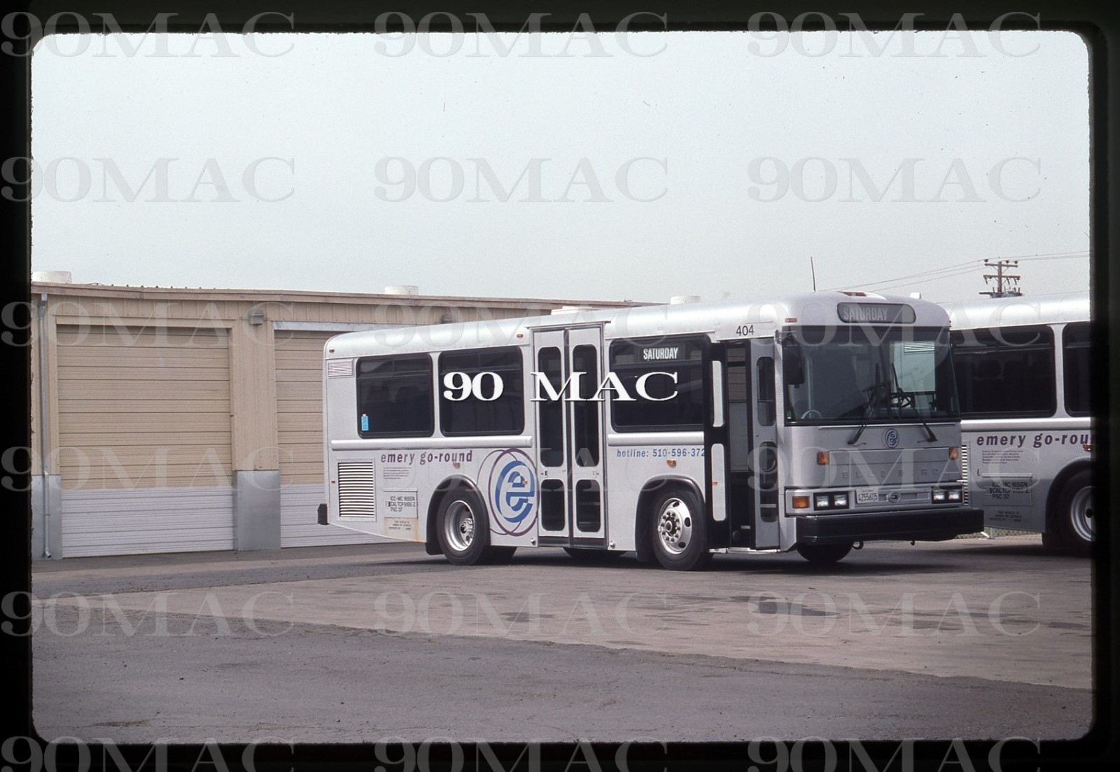 EMERY GO-ROUND. BLUEBIRD BUS #404. SFO (CA). Original Slide 1996.