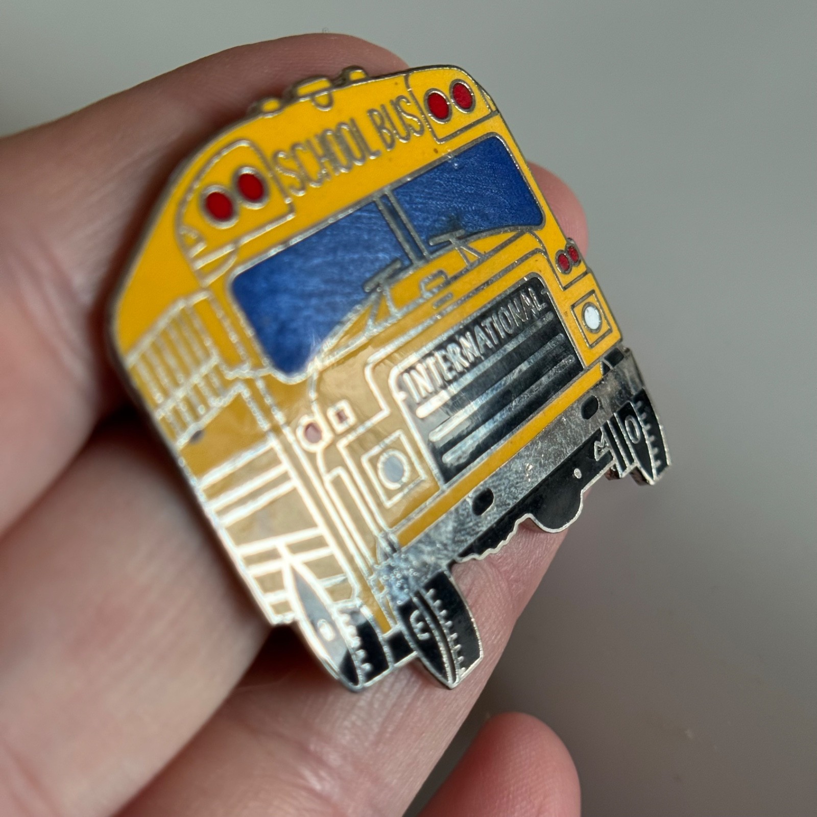 Vintage INTERNATIONAL School Bus Enamel Lapel Hat Pin Student Transportation