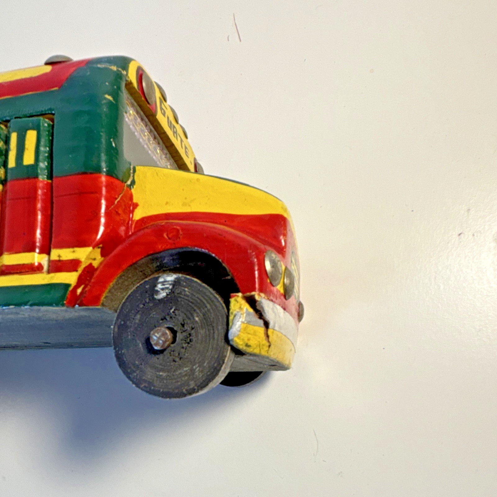 Vintage hand-painted, collectible toy replica of a Guatemalan “chicken bus”.