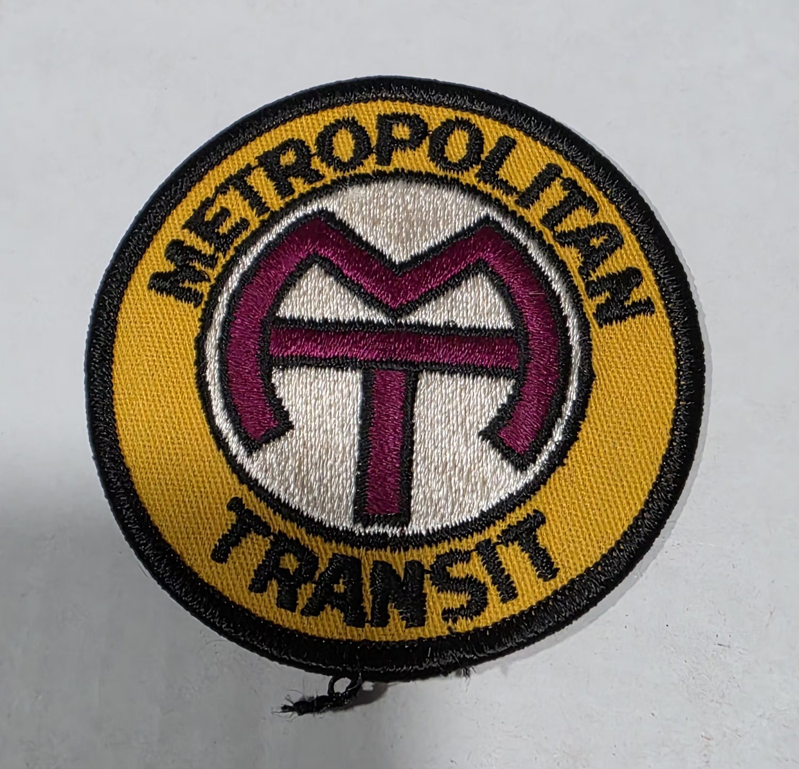 This vintage Chicago Transit Authority (CTA) “Metropolitan Transit” logo uniform